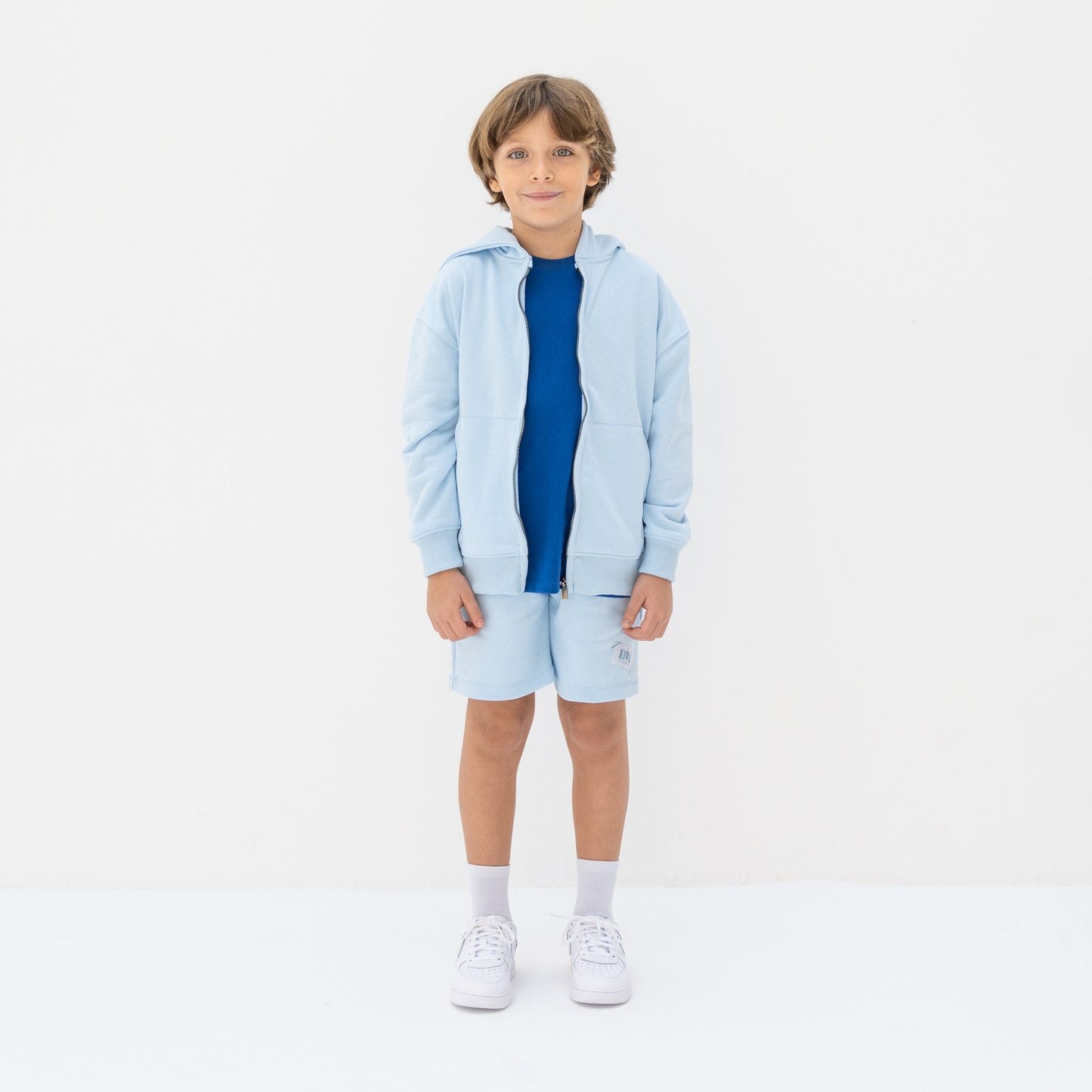 KIDD, @kidd.ae e-shop conceptual children’s brand genderless clothing I AM hoodie color sky blue Dubai