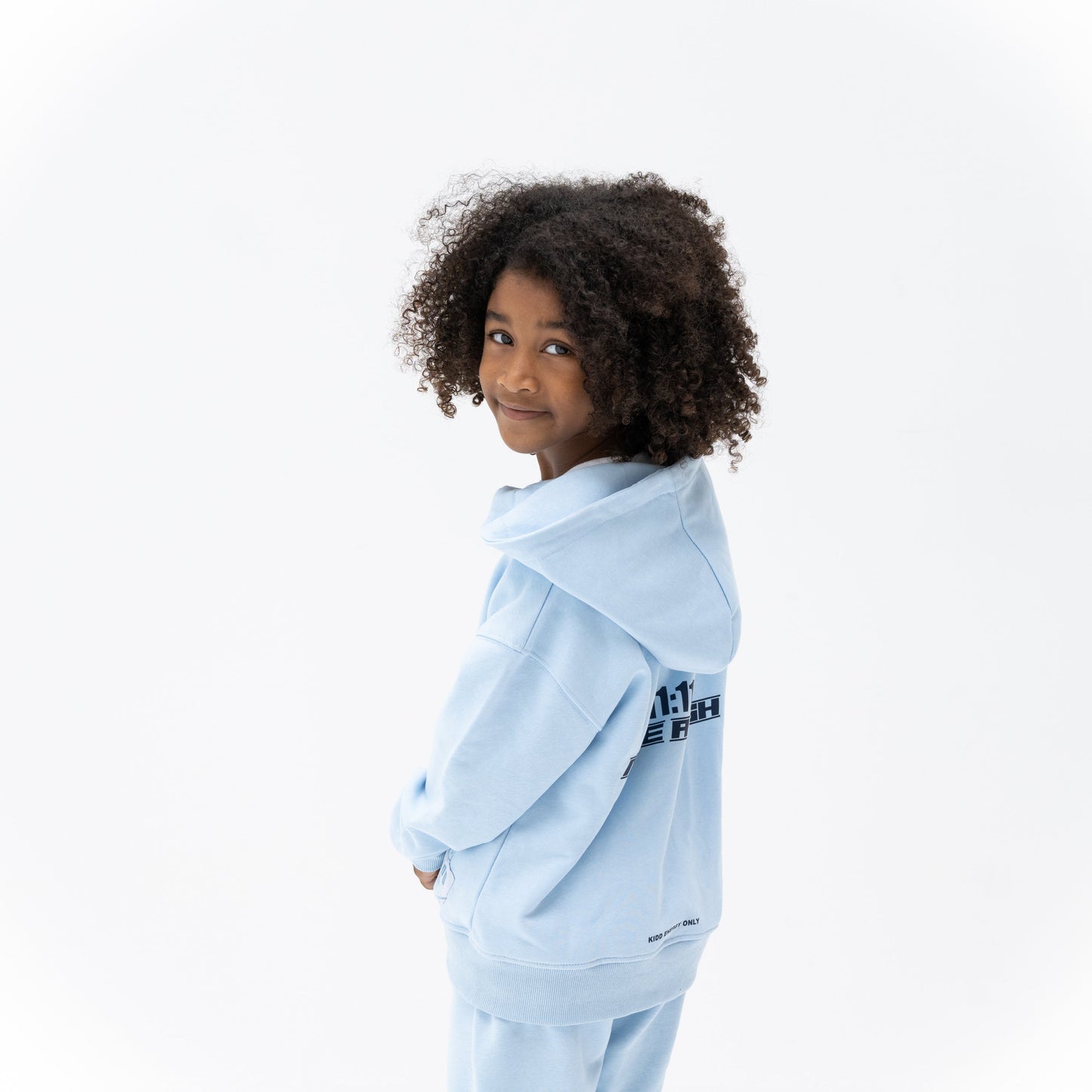 KIDD, @kidd.ae e-shop conceptual children’s brand genderless clothing 11:11 hoodie color sky blue Dubai