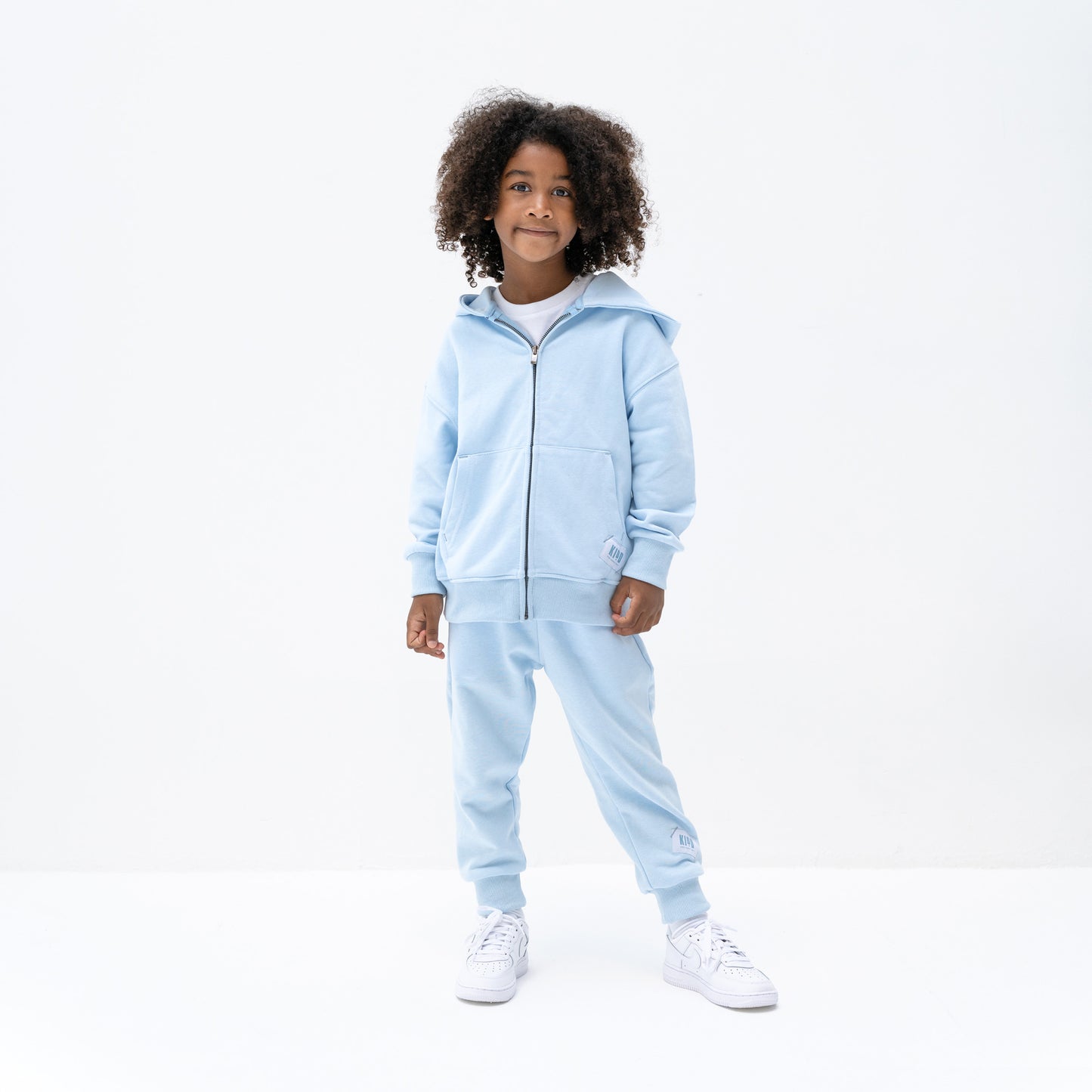 KIDD, @kidd.ae e-shop conceptual children’s brand genderless clothing 11:11 hoodie color sky blue Dubai