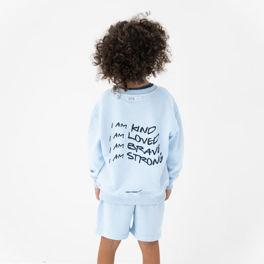 KIDD, @kidd.ae e-shop conceptual children’s brand genderless clothing I AM sweatshirt color sky blue Dubai
