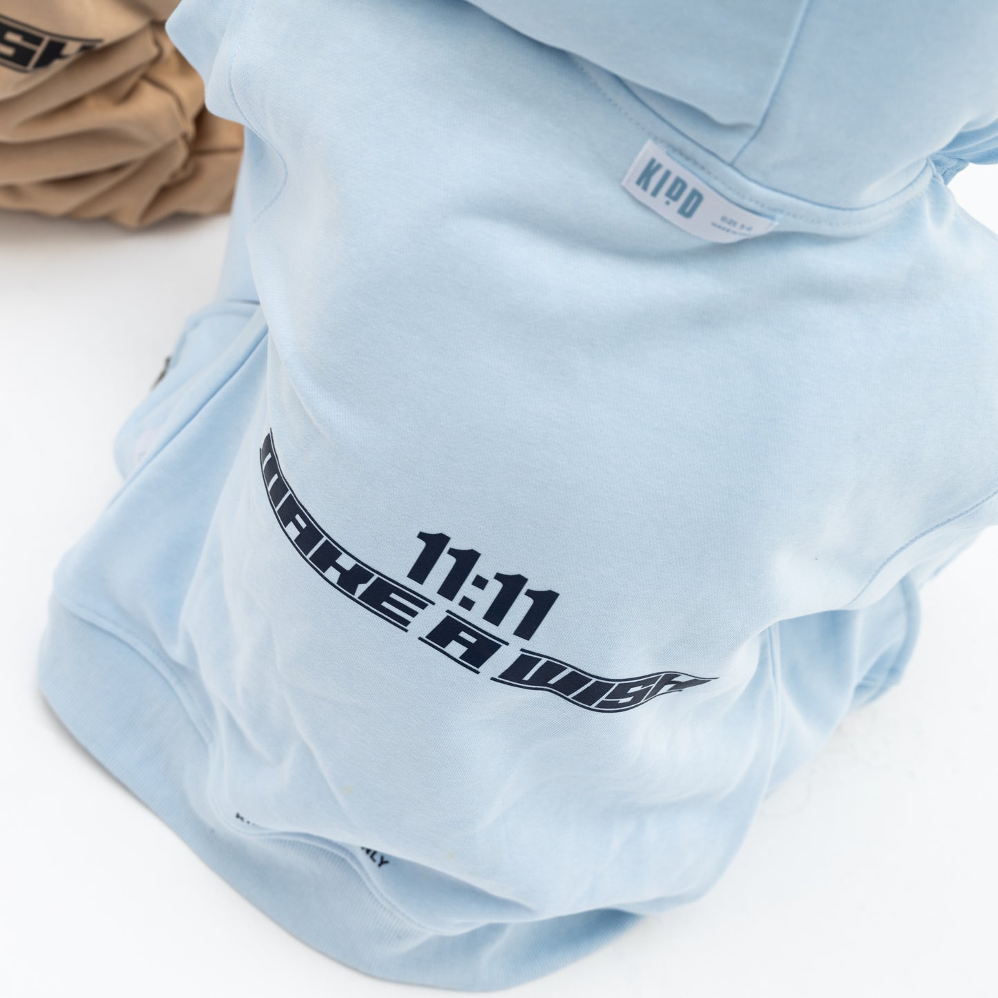 KIDD, @kidd.ae e-shop conceptual children’s brand genderless clothing 11:11 hoodie color sky blue Dubai