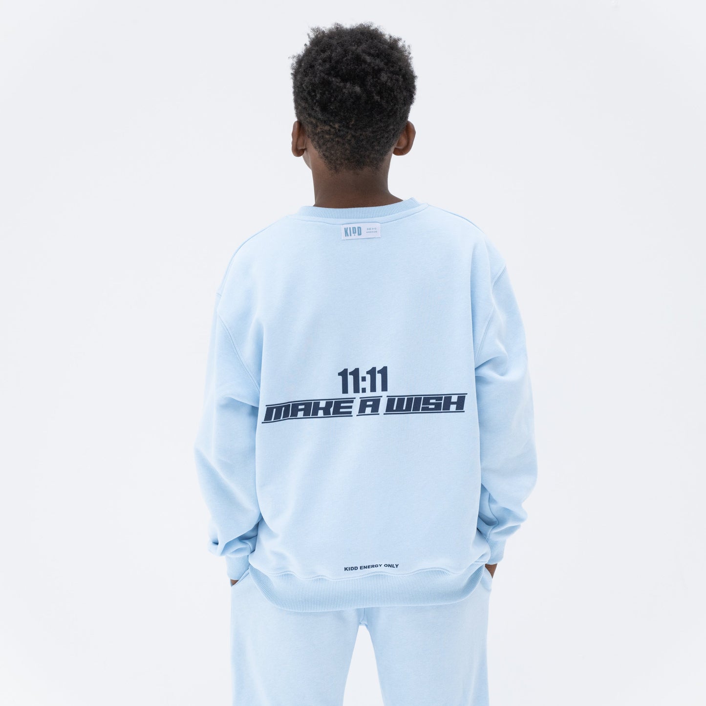 KIDD, @kidd.ae e-shop conceptual children’s brand genderless clothing 11:11 sweatshirt color sky blue Dubai