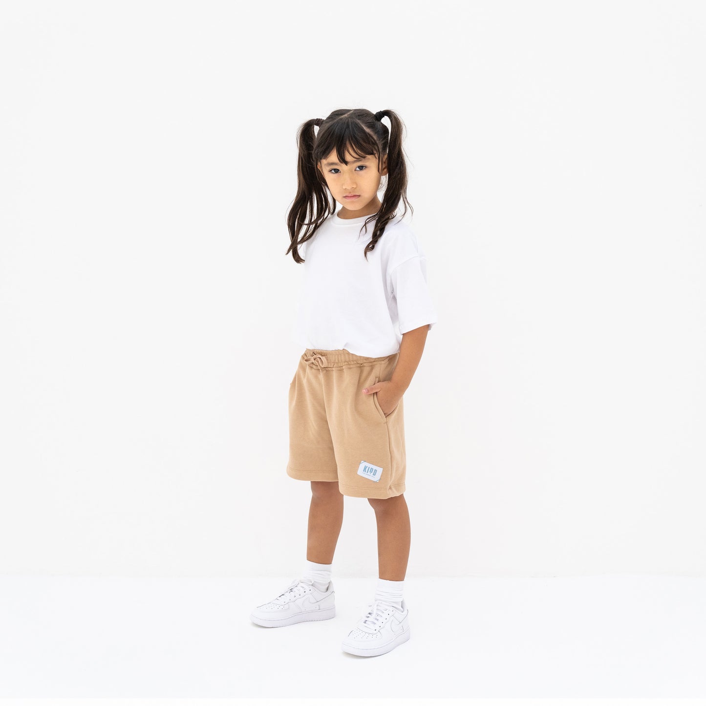 KIDD, @kidd.ae e-shop conceptual children’s brand genderless clothing shorts color sand / beige Dubai