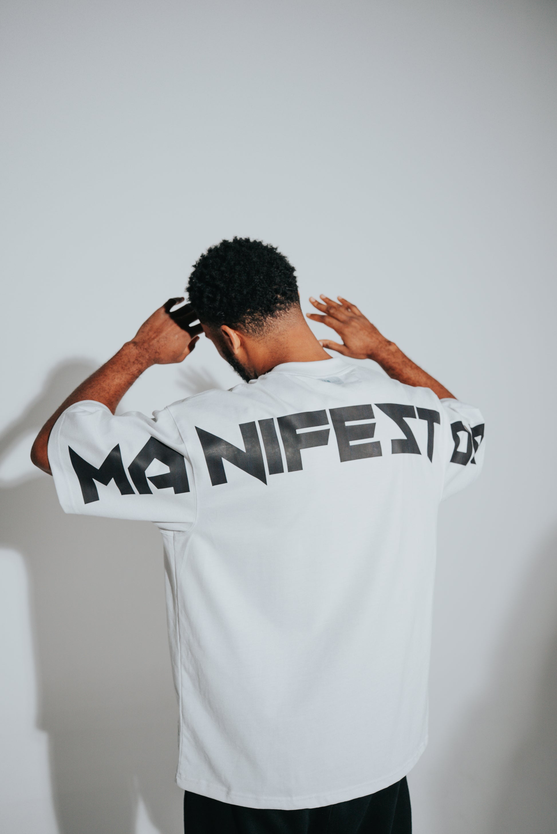 KIDD, @kidd.ae e-shop conceptual brand genderless clothing Manifestor t-shirt oversized fit premium color white Dubai