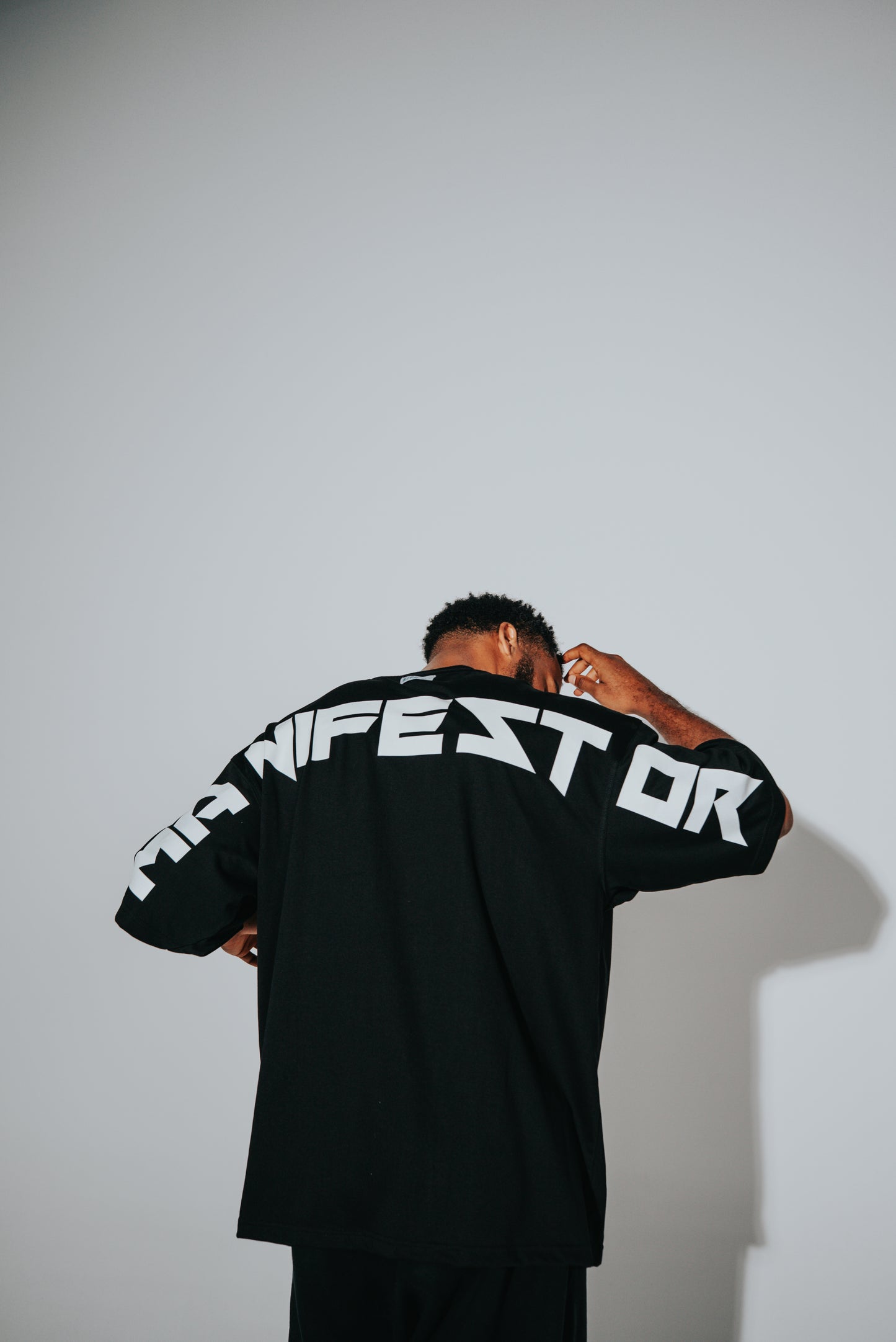 KIDD, @kidd.ae e-shop conceptual brand genderless clothing Manifestor t-shirt oversized fit premium color black Dubai