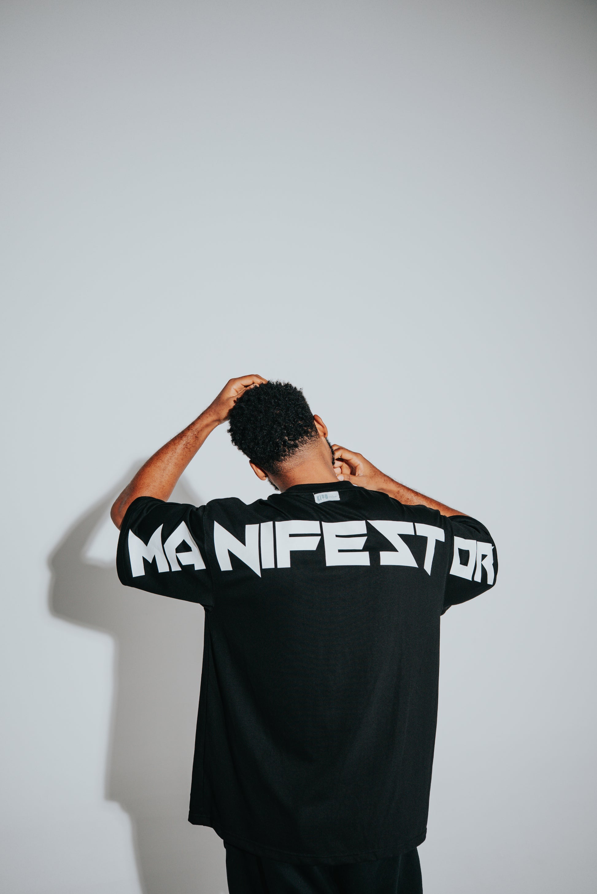 KIDD, @kidd.ae e-shop conceptual brand genderless clothing Manifestor t-shirt oversized fit premium color black Dubai