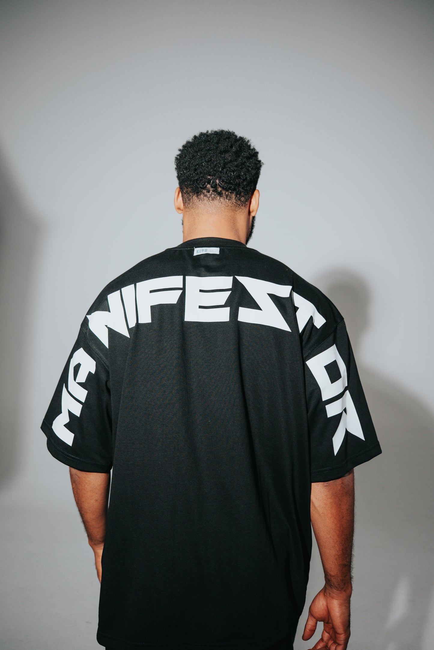 KIDD, @kidd.ae e-shop conceptual brand genderless clothing Manifestor t-shirt oversized fit premium color black Dubai
