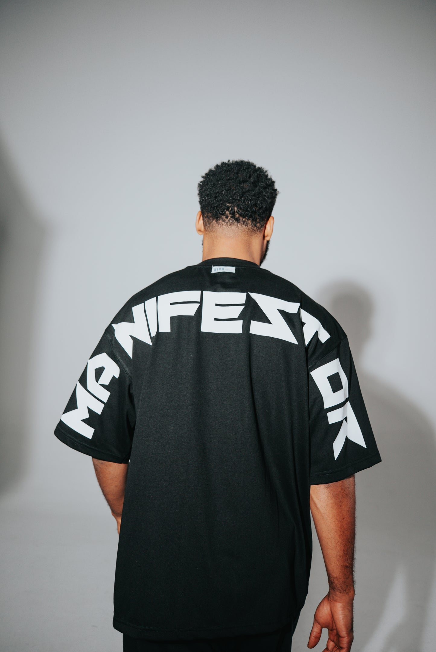 KIDD, @kidd.ae e-shop conceptual brand genderless clothing Manifestor t-shirt oversized fit premium color black Dubai