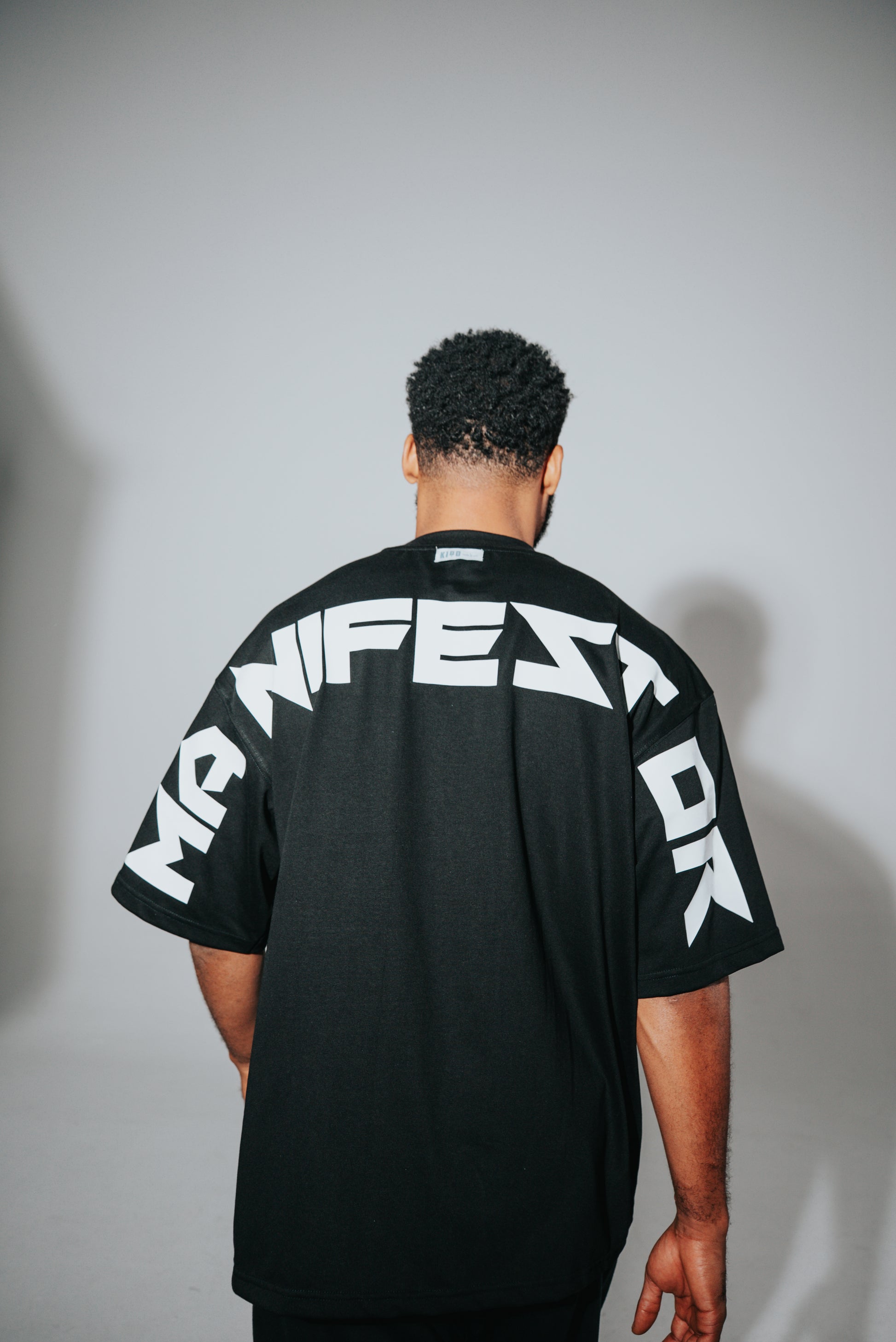 KIDD, @kidd.ae e-shop conceptual brand genderless clothing Manifestor t-shirt oversized fit premium color black Dubai