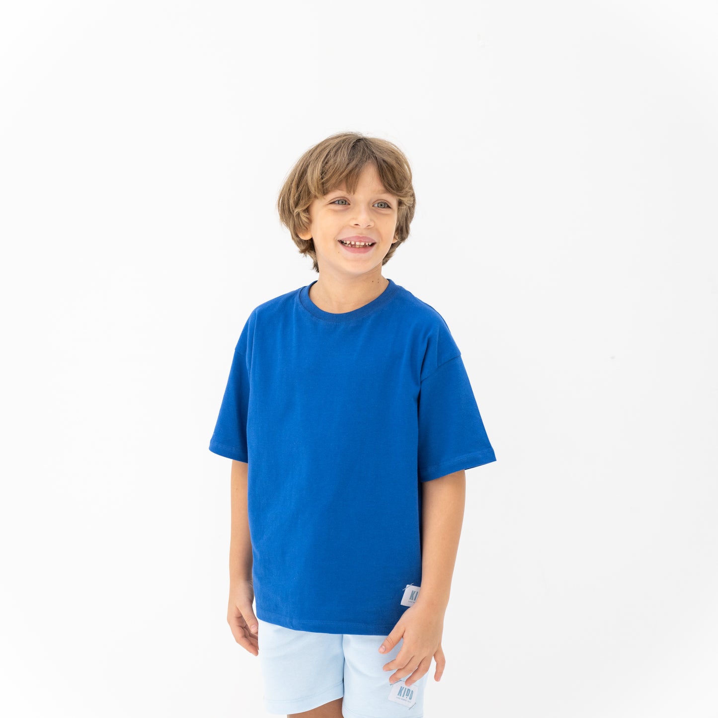 KIDD, @kidd.ae e-shop conceptual children’s brand genderless clothing I AM t-shirt color cobalt blue Dubai