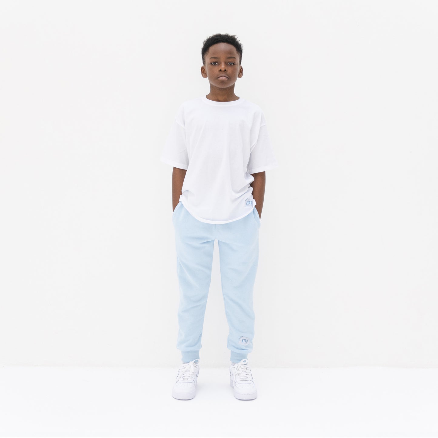 KIDD, @kidd.ae e-shop conceptual children’s brand genderless clothing jogger color sky blue Dubai