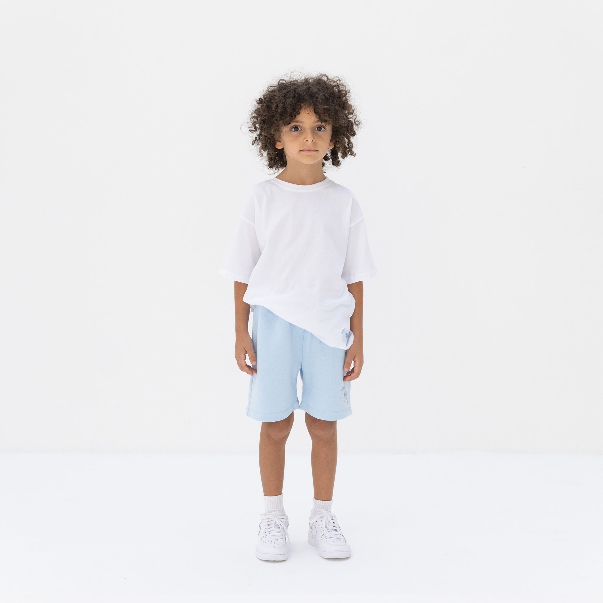 KIDD, @kidd.ae e-shop conceptual children’s brand genderless clothing shorts color sky blue Dubai