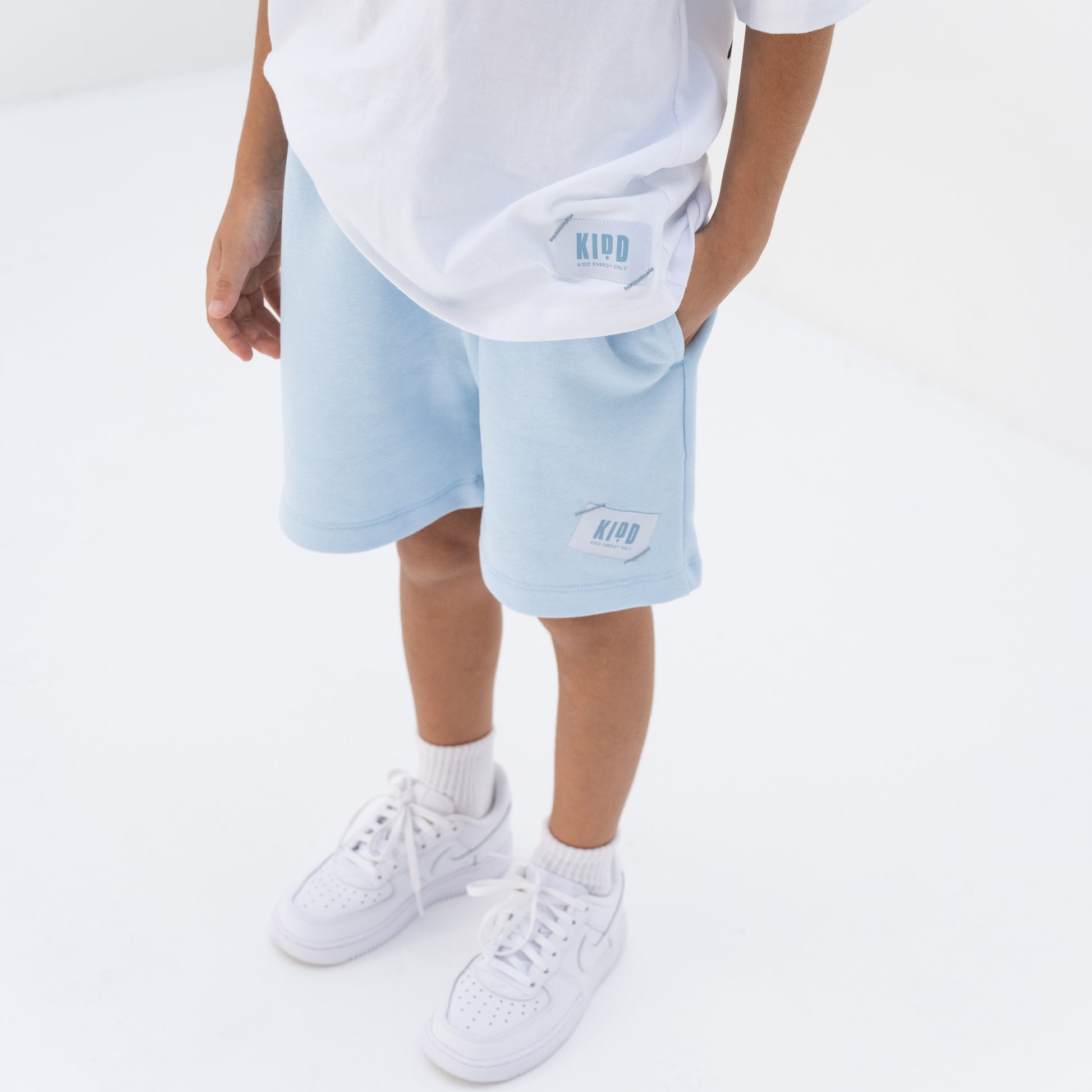 KIDD, @kidd.ae e-shop conceptual children’s brand genderless clothing shorts color sky blue Dubai